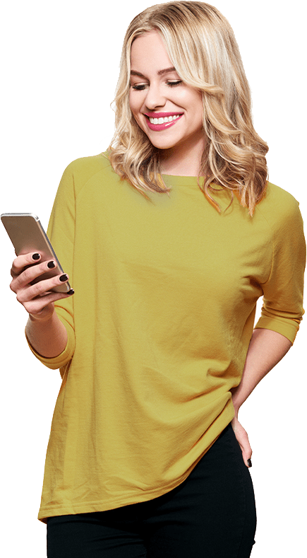 woman smiling at her mobile phone