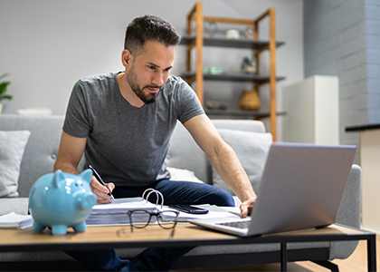 Man working on finances from home computer